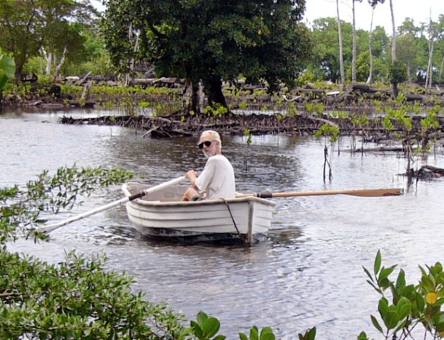 Jerry rowing the canal with broken oar